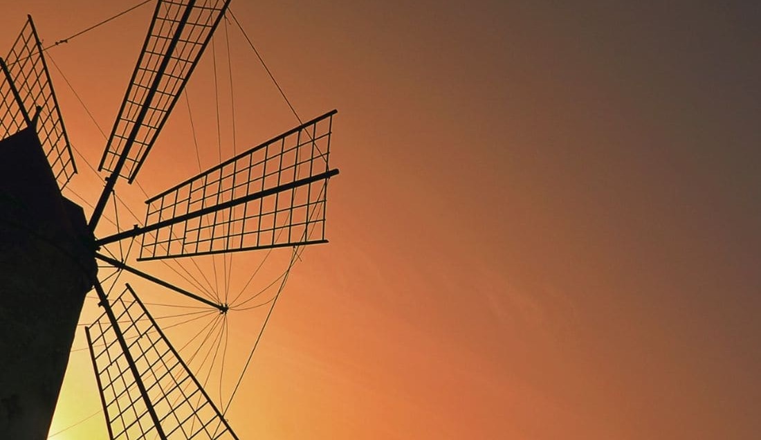 Capture the iconic windmills at Stagnone