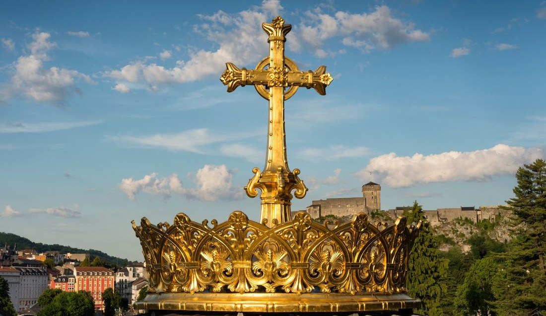The Golden Cross and crown on the Basilica Lourdes France