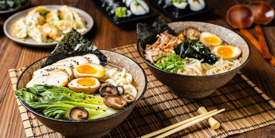 Two bowls of Ramen and sushi in Japan