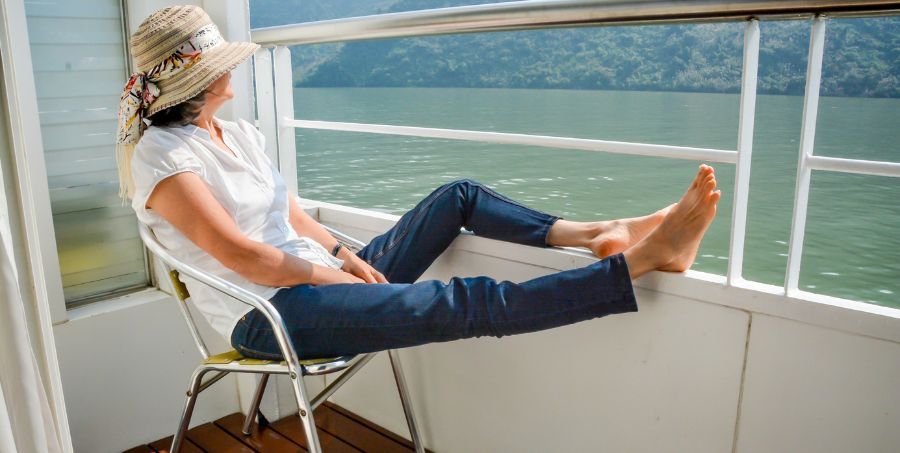 Woman_with_feet_on_railng_of_boat_Yangtze_river_cruise.jpg