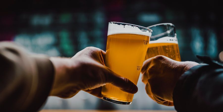 hands toasting with glasses of craft beer at the pub.jpg