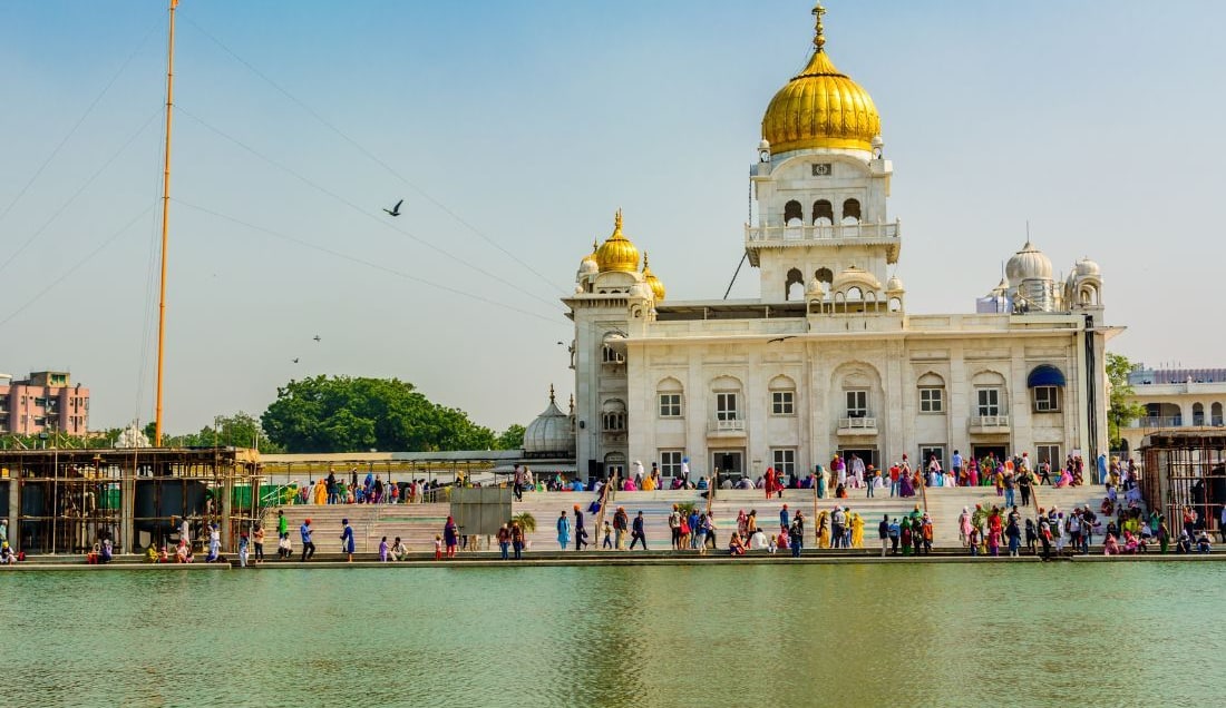 Visit the serene Gurudwara Bangla Sahib in Delhi, one of the city's most prominent Sikh temples.