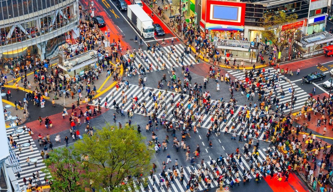 Experience the vibrant energy of Shibuya Crossing, Tokyo’s iconic intersection.
