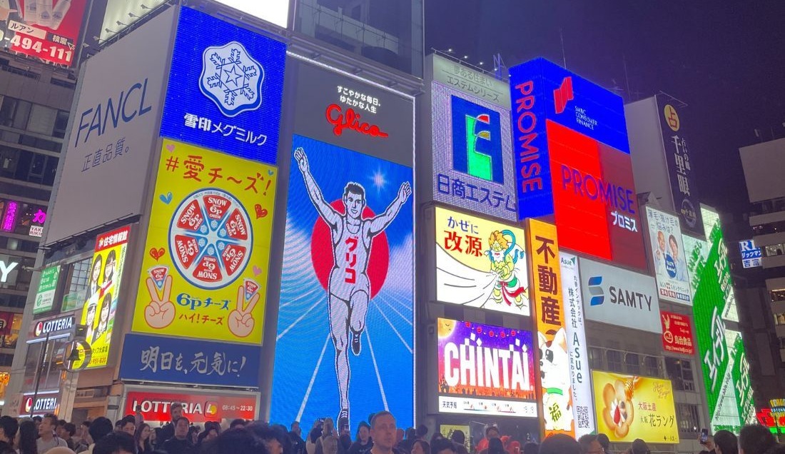 Experience the neon lights of Dotonbori district in Osaka.