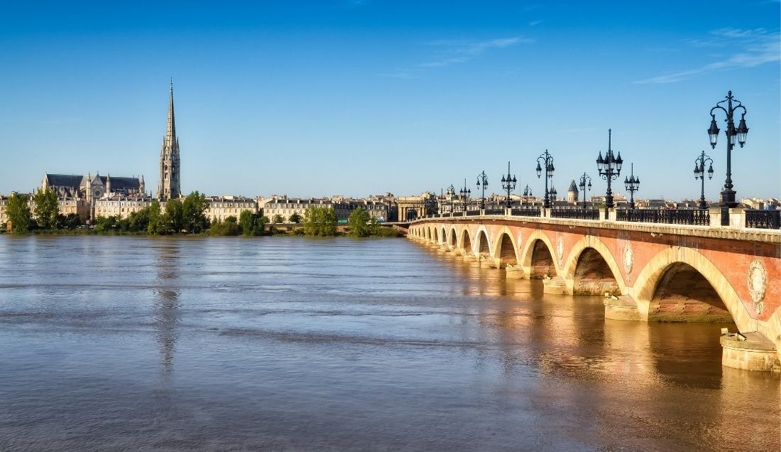 Cross the historic Pont de Pierre in beautiful Bordeaux