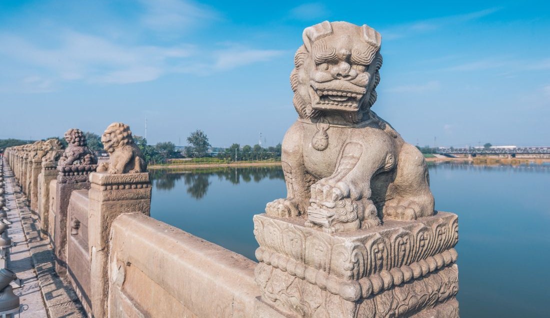 Visit the Marco Polo Bridge near Beijing, famed for its carved stone lions.