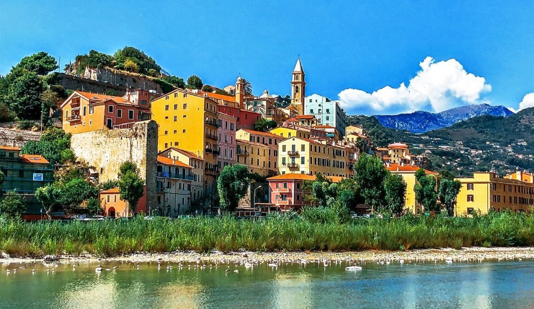 See the colourful buildings of Ventimiglia.