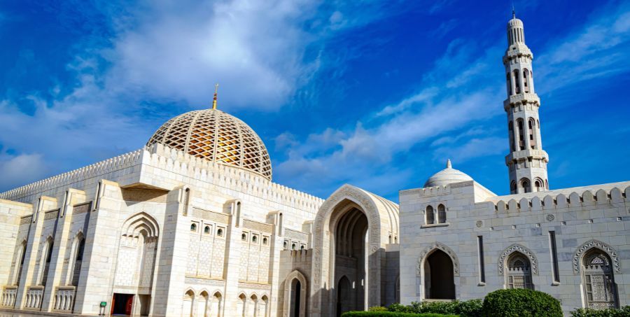 See the spectacular Grand Mosque of Muscat. 