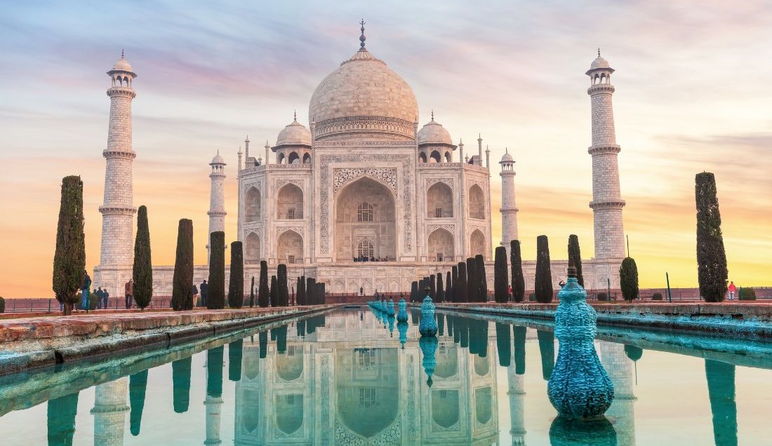 Experience the sunrise or sunset at the Taj Mahal.